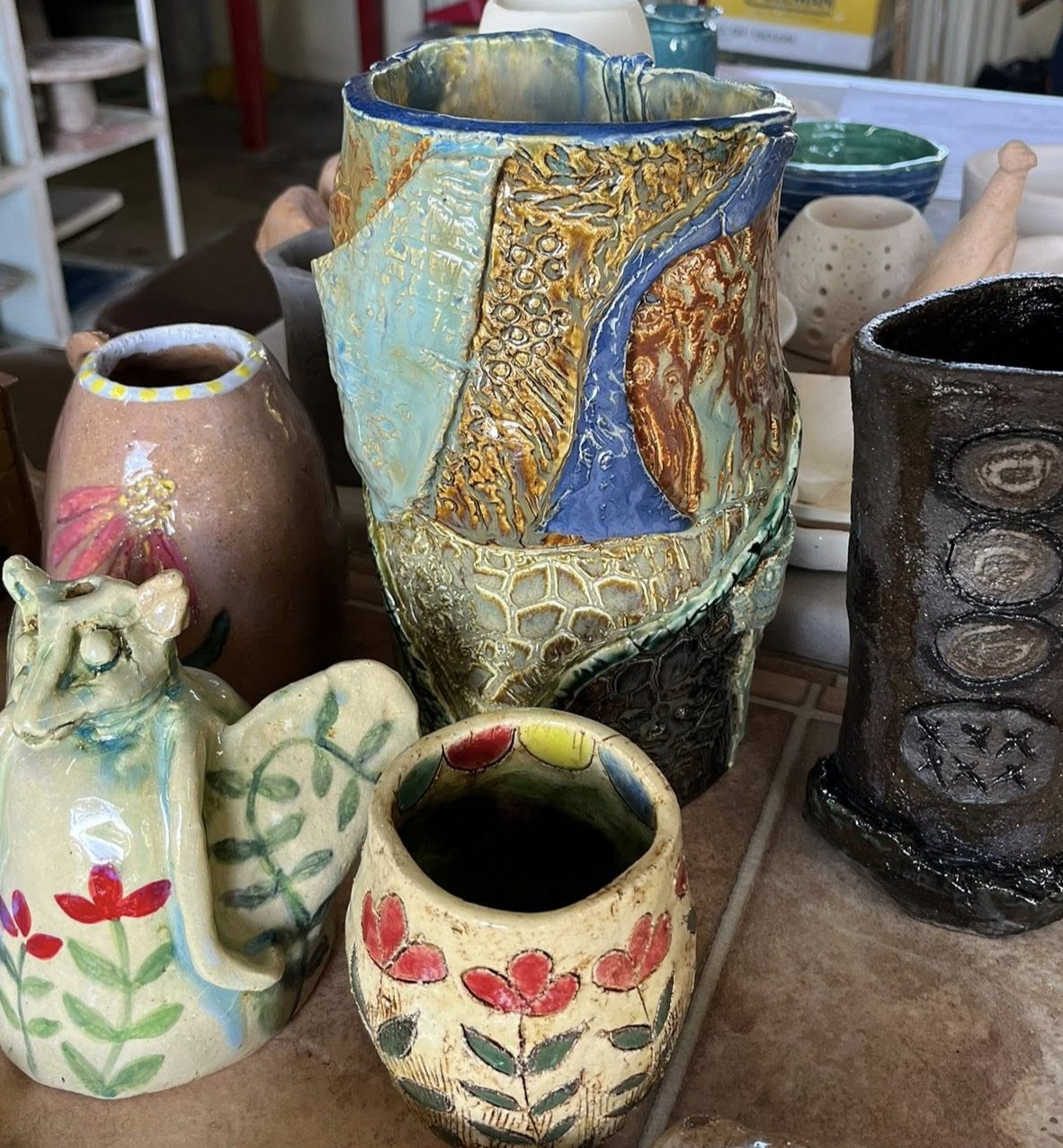 Collection of handcrafted pottery vases and vessels